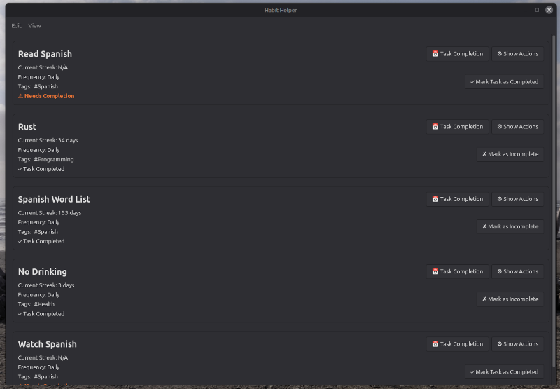 Listing saved tasks with a dark desktop theme active.
