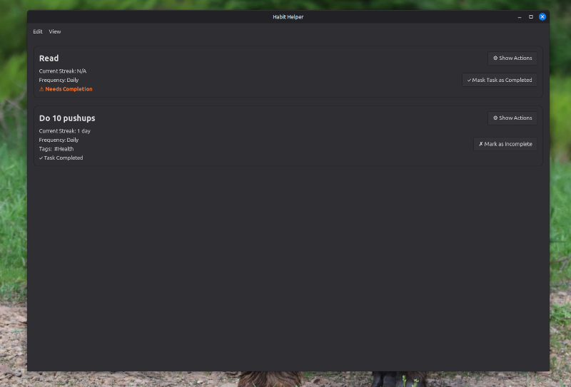 Listing saved tasks with a dark desktop theme active.